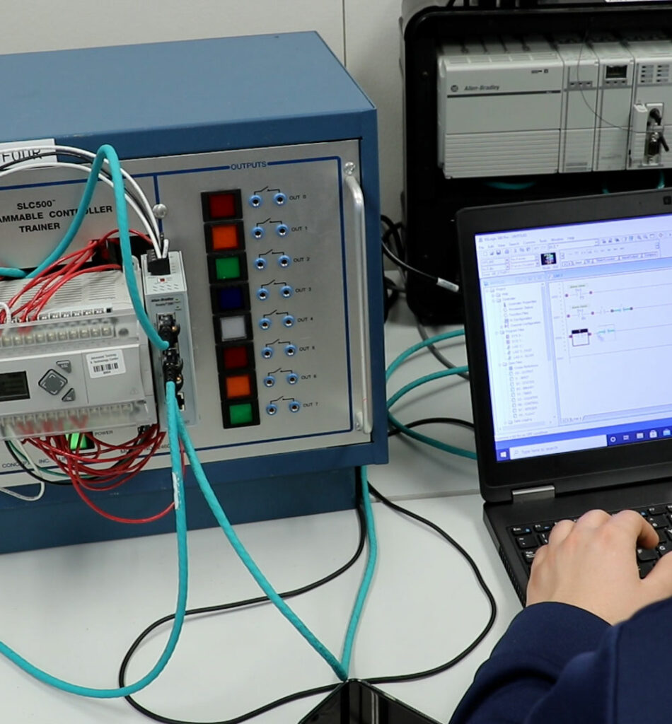 student learning to use a programmable controller